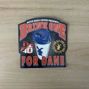 Dutch Bros Drink One for Dane Sticker - Red, Blue, Gold, and Black